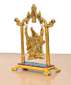 Golden Radha Krishna swing idol, side angle, colorful base trim