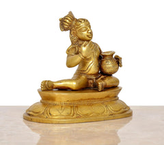 Krishna Laado Gopal brass statue, seated pose with laddu, detailed pedestal