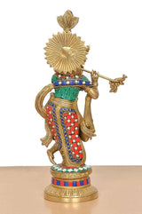Brass Krishna idol playing flute, back/side view with halo and multicolor belt