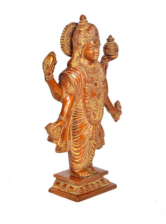 Dhanvantari brass statue, profile view, raised arm holding small pot