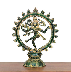 Dancing Shiva brass figurine with green patina and golden arms, full view on base