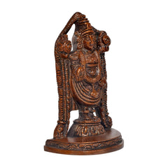 Angled view idol statue with elaborate head crown, layered robes and round base, dark brass