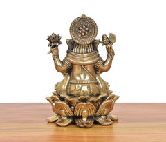 Bronze Lord Ganesha murti, three-quarter view with ornate halo crown and lotus base
