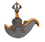 Brass dorje flaying knife top, dark crescent blade with tall central figure stem