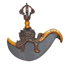 Brass dorje flaying knife top, dark crescent blade with tall central figure stem