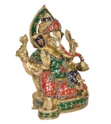 Brass Ganesh idol side view, jeweled crown and green-red robe on pedestal base