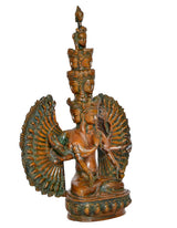 Brass Avalokiteshvara idol with layered faces, prayer pose, and wide fan arm details