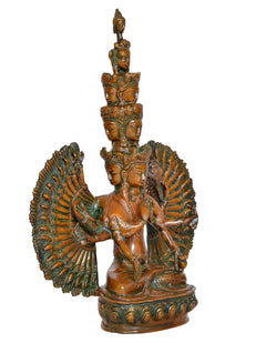 Brass Avalokiteshvara idol with layered faces, prayer pose, and wide fan arm details