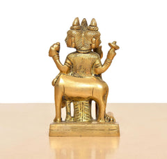 Rear view brass Trimurti idol, curved ornaments, raised arms, 4.5 in