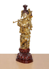 Radha Krishna brass idol in standing pose, maroon crown and gold ornaments, red base