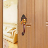 AONA Buddha-face door handle, brass, gold face and red stem