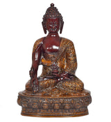 Sitting Buddha idol front view, closed eyes, dark red body with ornate gold detailing