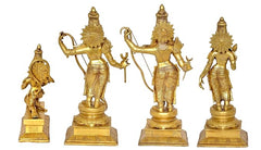 Golden brass deity figurines set with ornate crowns, standing on carved bases