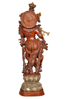 Rear view Krishna brass statue with circular disc backplate, red and gold finish
