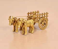 Brass vintage bullock cart with double bulls pulling, front view with reins and yoke
