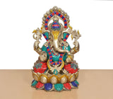 Brass Ganesha sitting on lotus, detailed crown and multicolor beadwork