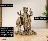 Bronze showpiece: multi-armed deity holding pot, standing by bull on ornate base