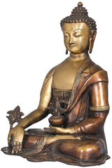 Antique brass seated Buddha figurine, side view with raised hand and decorative hem