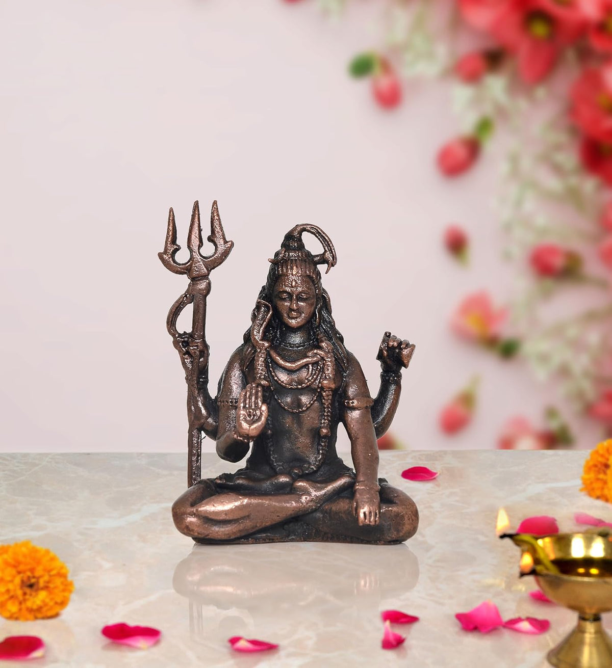 Copper Lord Shiva sculpture for home mandir, seated with trident and raised hand