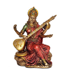 Resin Mata Saraswati idol standing with veena, red pleated sari, gold base, front view