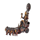 Brass sun chariot statue side view: deity seated on wheeled chariot, 7 horses.