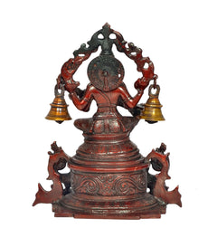 Back view of Brass Saraswati idol with decorative arch and two bell pots