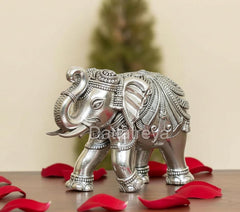 Silver elephant figurine, 3-inch height, three-quarter view, patterned saddle details.