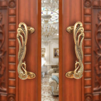 Brass peacock design door handle pair, ornate relief handle plates with back mounts