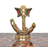 Brass Ganesha idol with jeweled crown and red/green enamel accents