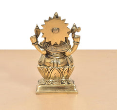 Brass Ganpati Bappa idol rear view, sunburst back design on the seated base