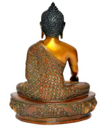Brass Buddha statue from rear, meditating seated posture on decorated lotus base