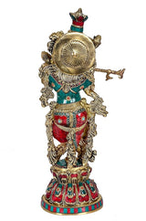 Krishna brass sculpture back view with circular medallion, teal and red jeweled outfit