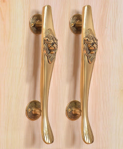 Brass gold door pull handles pair with lion face detail on vertical grip bars