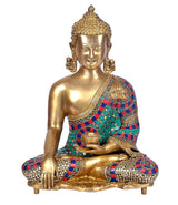 Seated brass Buddha statue with earth-touching hand, gold face, colorful jeweled sash