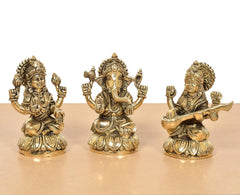 Brass Lakshmi Ganesha Saraswati idol set, three golden seated deities with detailed crowns
