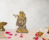 Brass Radha Krishna idol statue with colorful gem-like inlays, standing on base