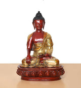 Seated Buddha ornament with dark hair texture, red skin finish, gold robe details, on base