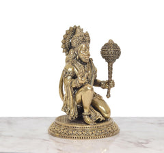 Hanuman JI bronze-tone sitting sculpture, facing left with ornamented crown and base