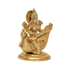 Side view of brass Saraswati sitting on swan, intricate ornamental carvings