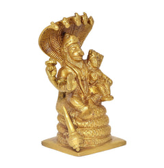 Gold brass Lakshmi Narasimha statue, angled view with spear-like staff and base