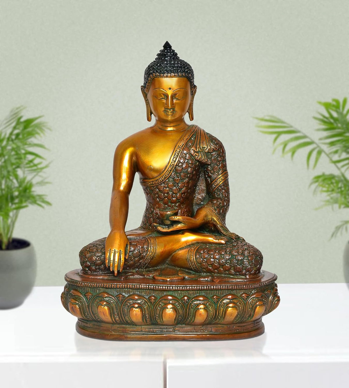 Brass Buddha statue meditating in Dhyan mudra, gold and green patina, seated on round base