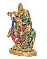 Radha-Krishna brass cow idol statue, front view with detailed jeweled blue-red clothing