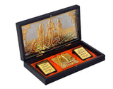 Open black case with glass top view of gold-plated Lord Ram Darbar and red base insert