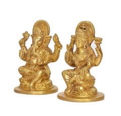 Brass Ganesha and Lakshmi idol statues, side view, seated on lotus bases