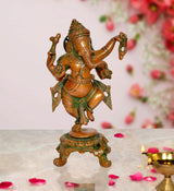 Brass Lord Ganesha dancing statue with green-gold detailing, standing on ornate base