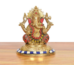 Front view multicolor brass Ganesh idol, seated pose with detailed red and blue accents