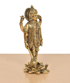Side view of golden Brass Lord Vishnu standing idol, crown and layered ornaments