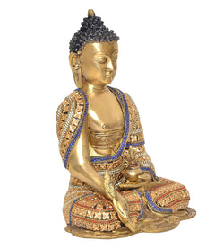 Three-quarter brass Buddha statue, jeweled robe with blue trim and ornate patterns on base