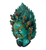 Green resin Mahakal wall hanging mask, side view with detailed flame hair and ornaments