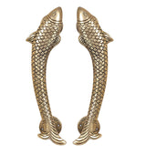 Pair of golden brass fish-shaped door handles with scalloped scales and backplates